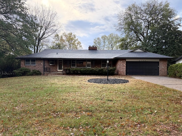 ranch-style house with a garage and a front lawn