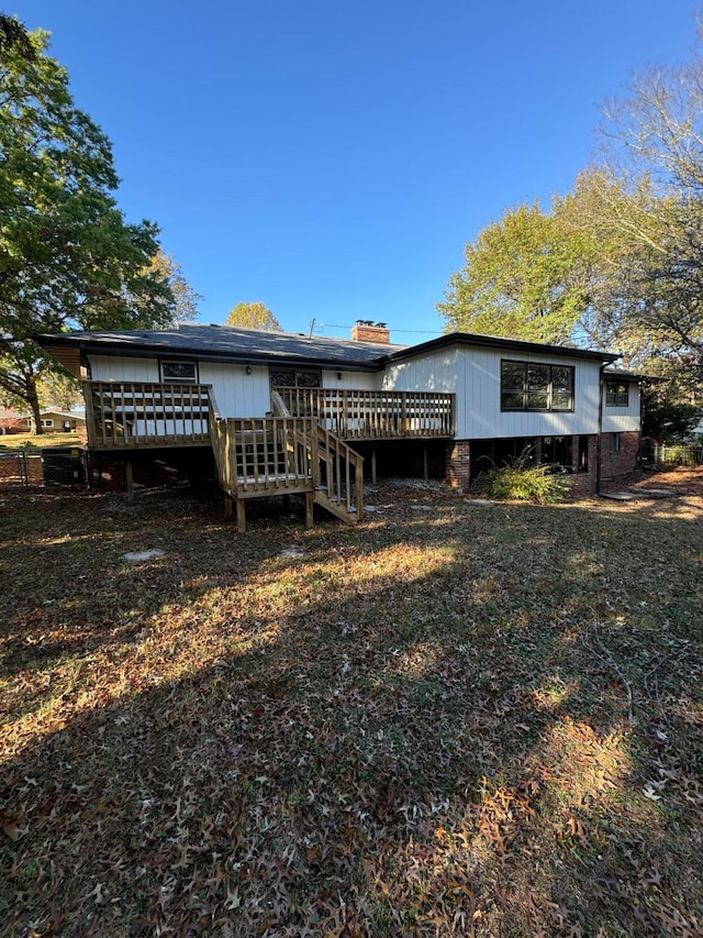 back of property featuring a deck