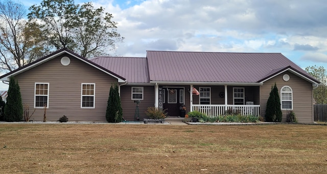 view of front facade featuring a front lawn and a porch