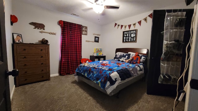 bedroom with ceiling fan and carpet flooring