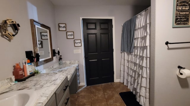 bathroom with vanity and tile patterned flooring