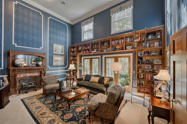 living area featuring a high ceiling, ornamental molding, and a fireplace