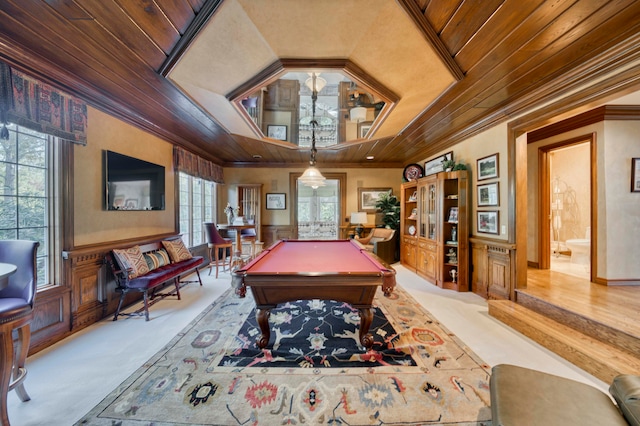 recreation room featuring plenty of natural light, crown molding, and wooden ceiling