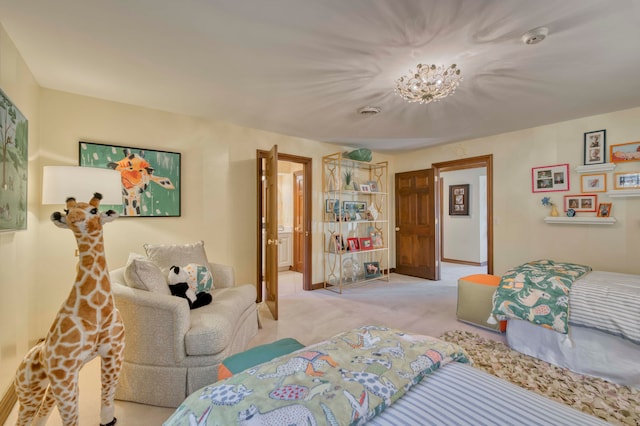 bedroom featuring light colored carpet and an inviting chandelier