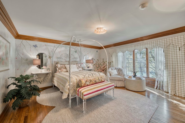 bedroom featuring wood-type flooring and crown molding