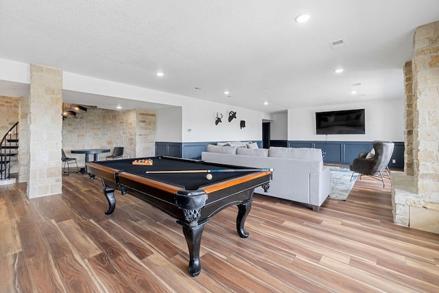 rec room featuring decorative columns, pool table, and light wood-type flooring