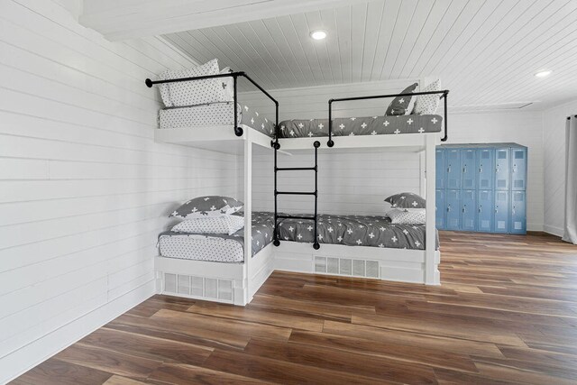 interior space with wood ceiling and dark hardwood / wood-style flooring