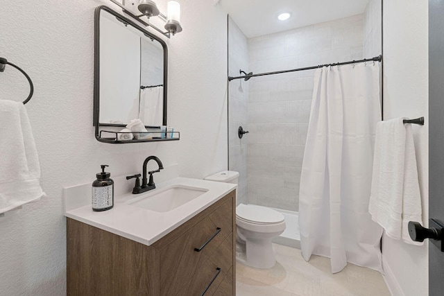 full bathroom with vanity, shower / bath combo, and toilet