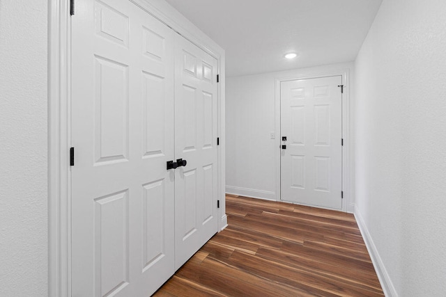 hall featuring dark wood-type flooring