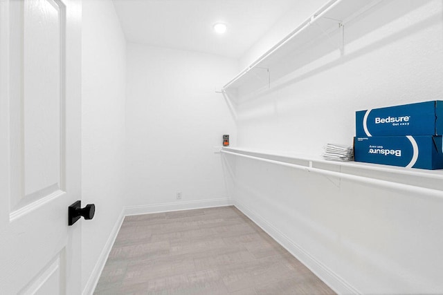 walk in closet featuring light hardwood / wood-style floors