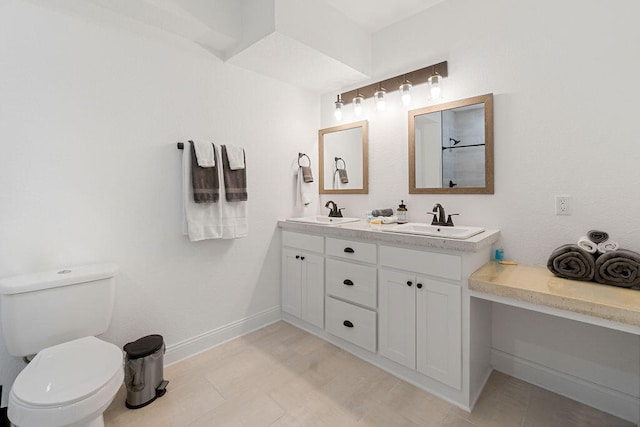 bathroom with toilet and vanity