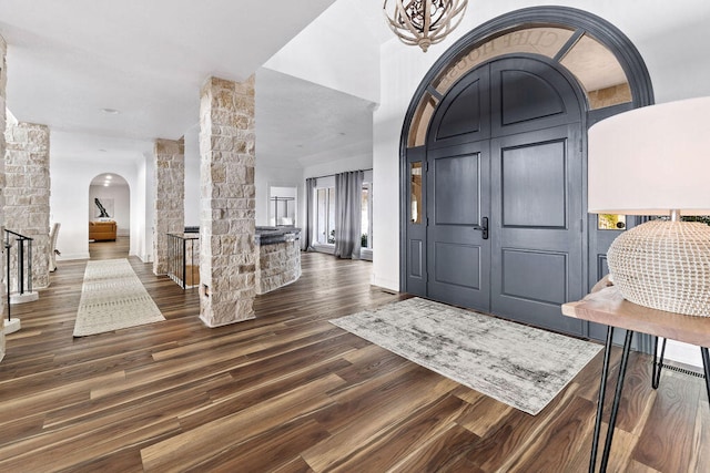 entryway with dark hardwood / wood-style flooring