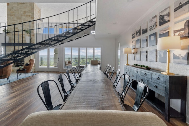 dining room with ornamental molding and hardwood / wood-style floors