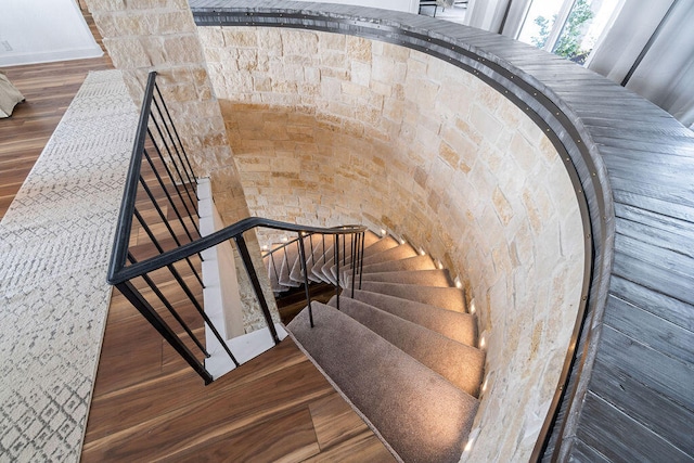 stairway with wood-type flooring