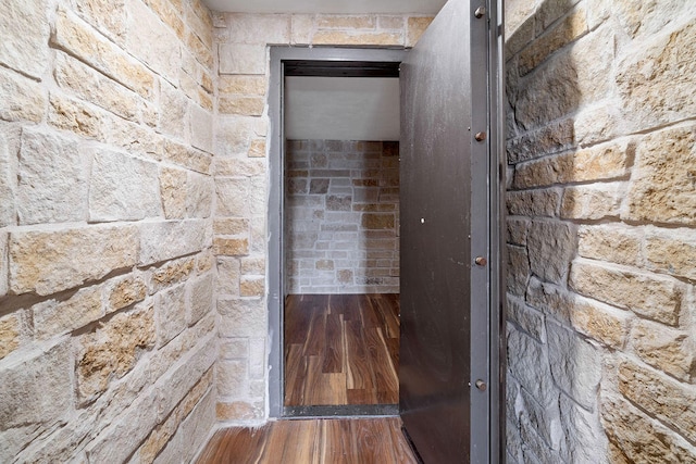 hallway featuring wood-type flooring