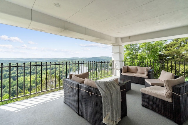 balcony featuring an outdoor living space and a mountain view