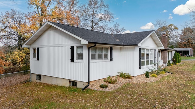 view of home's exterior with a lawn