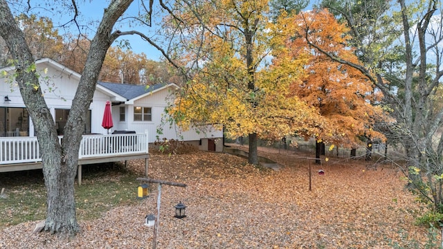 view of yard with a wooden deck