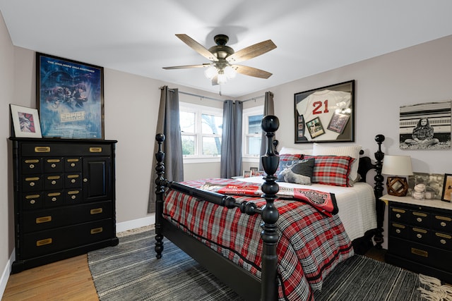 bedroom with ceiling fan and hardwood / wood-style flooring