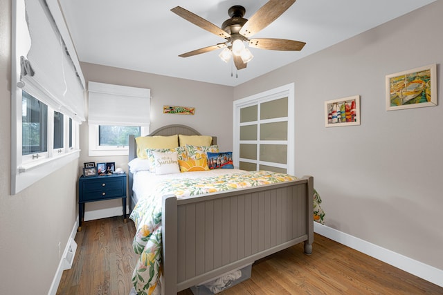 bedroom featuring ceiling fan and dark hardwood / wood-style flooring