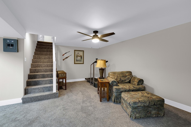 sitting room featuring carpet and ceiling fan