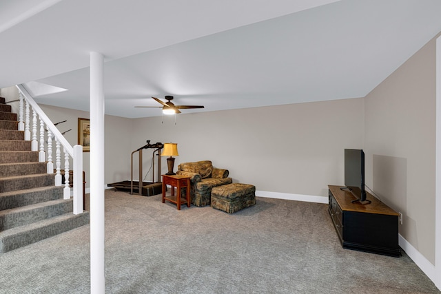 living area with carpet flooring and ceiling fan