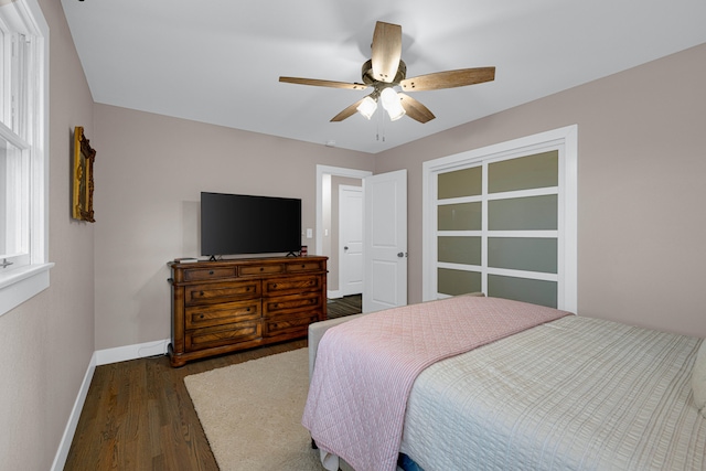 bedroom with dark wood-type flooring and ceiling fan