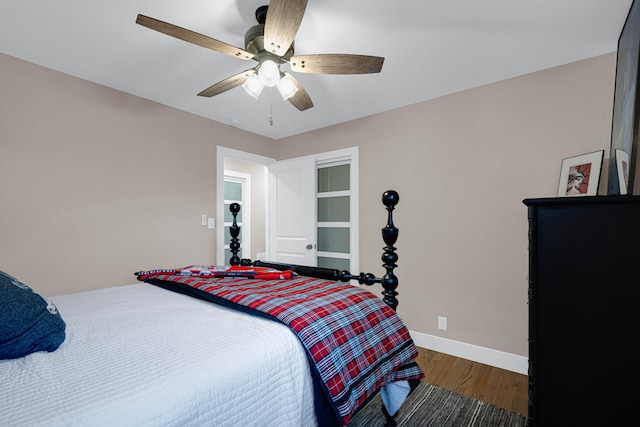 bedroom featuring ceiling fan and dark hardwood / wood-style flooring