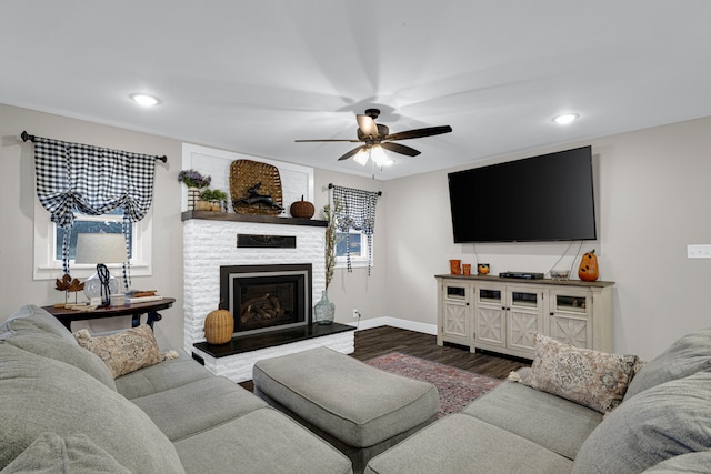 living room with hardwood / wood-style floors and ceiling fan