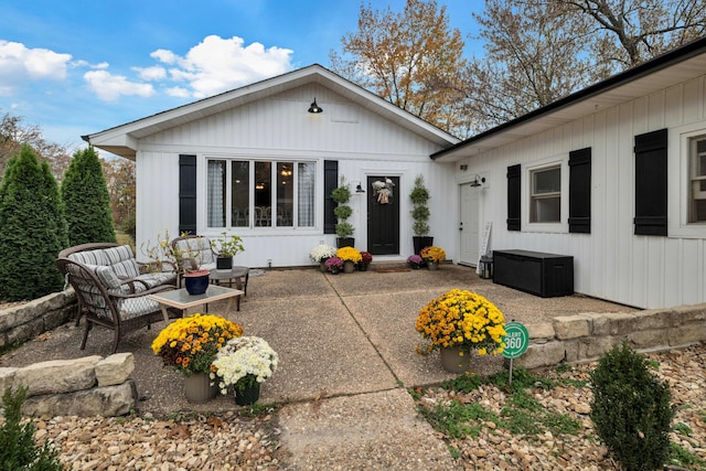 back of house with a patio area and an outdoor hangout area