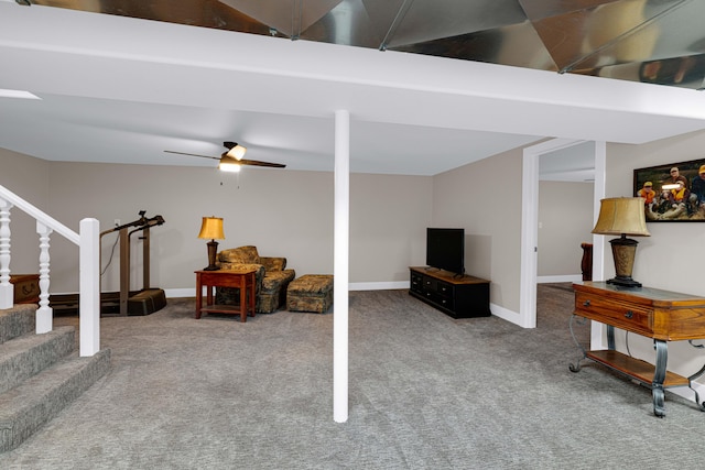 basement featuring carpet flooring and ceiling fan