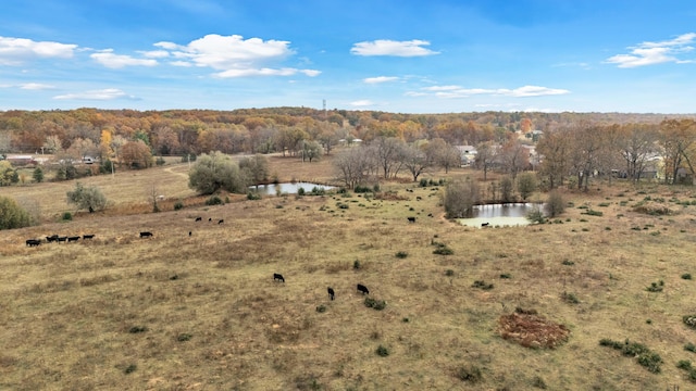 exterior space with a rural view and a water view