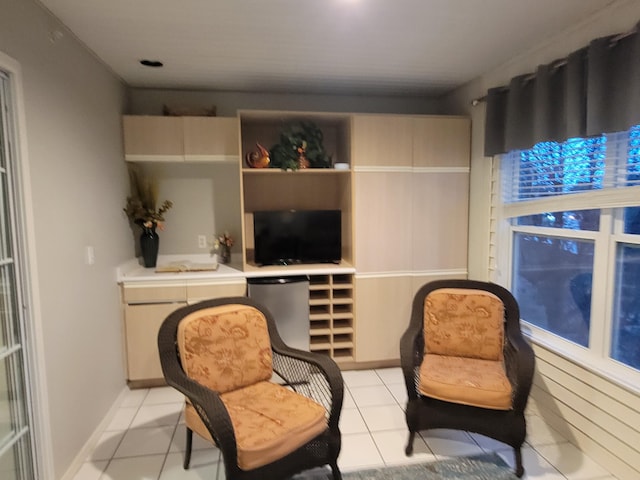 living area featuring light tile patterned floors