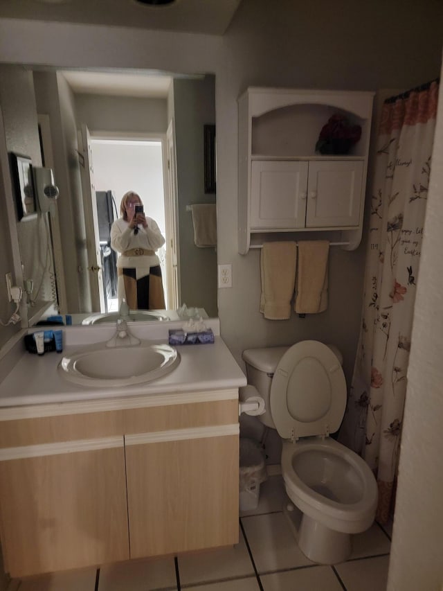 bathroom with vanity, toilet, tile patterned flooring, and a shower with shower curtain