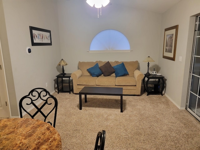 carpeted living room featuring ceiling fan