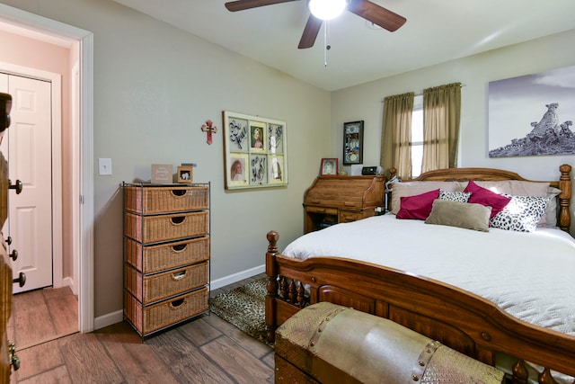 bedroom featuring ceiling fan and dark hardwood / wood-style floors