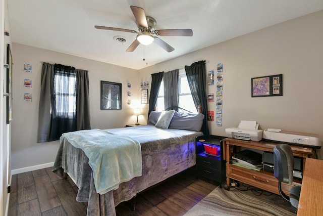 bedroom with dark wood-type flooring and ceiling fan