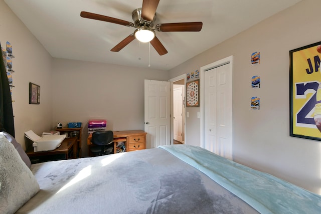 bedroom featuring ceiling fan and a closet