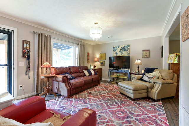 living room with hardwood / wood-style flooring and ornamental molding