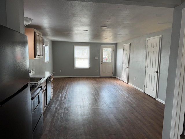 kitchen with stainless steel appliances, dark hardwood / wood-style floors, and sink