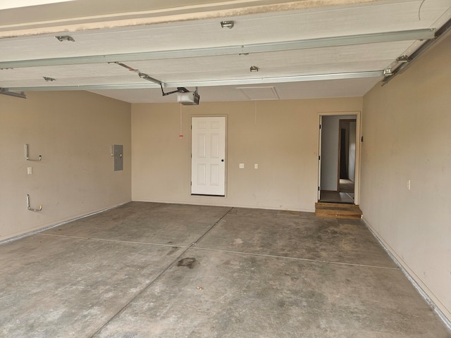 garage featuring electric panel and a garage door opener