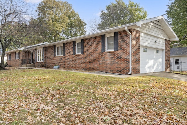 view of property exterior with a garage and a lawn