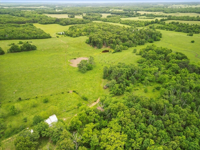 birds eye view of property with a rural view