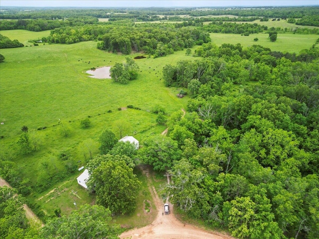 birds eye view of property featuring a rural view