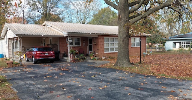 view of front of home with a carport