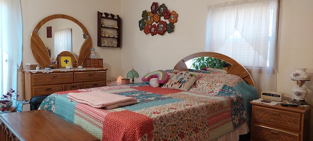 bedroom featuring multiple windows