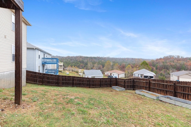 218 Windridge Rd, Branson, MO 65616 - view of yard featuring a view of trees and a garden