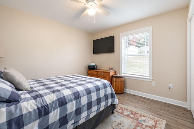 218 Windridge Rd, Branson, MO 65616 - bedroom with baseboards, light wood finished floors, and ceiling fan