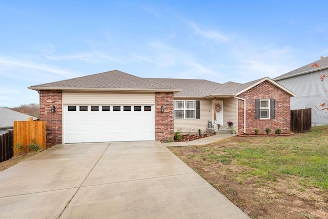 218 Windridge Rd, Branson, MO 65616 - ranch-style house with driveway, a garage, and brick siding