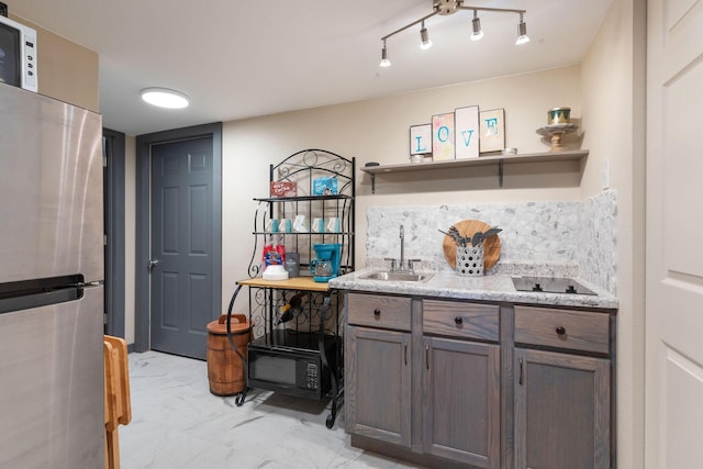 218 Windridge Rd, Branson, MO 65616 - kitchen featuring a sink, freestanding refrigerator, open shelves, light marble finish floors, and light stone countertops